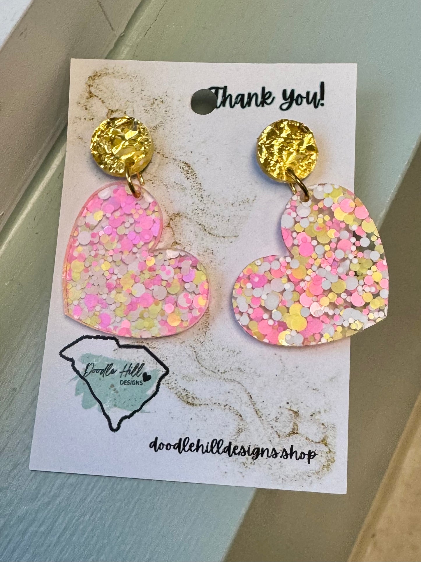 heart shaped earrings clear acrylic with gold, light pink and dark pink flakes with gold textured post