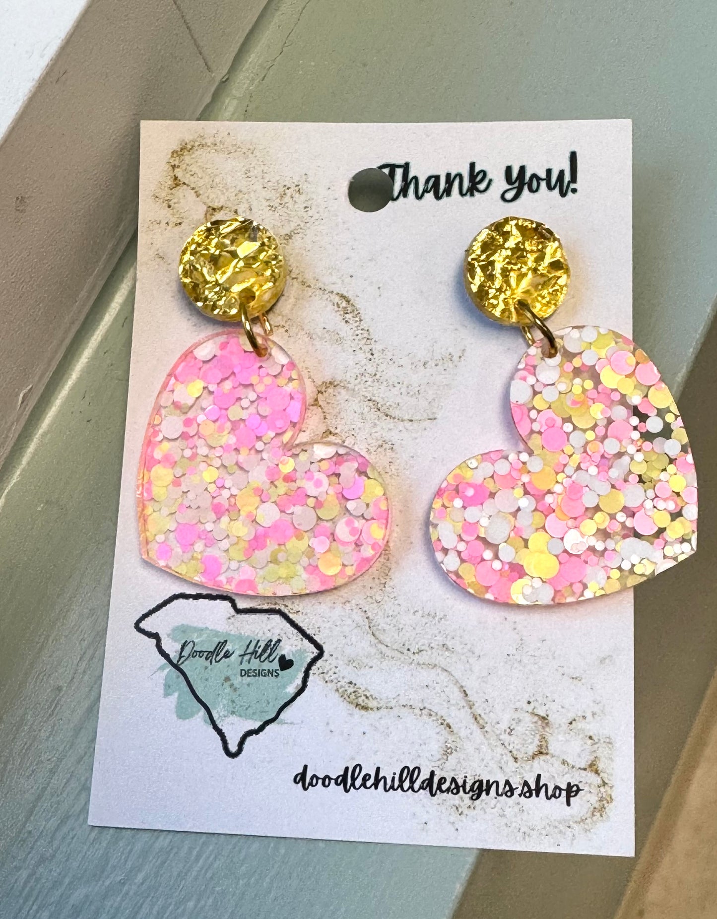 heart shaped earrings clear acrylic with gold, light pink and dark pink flakes with gold textured post