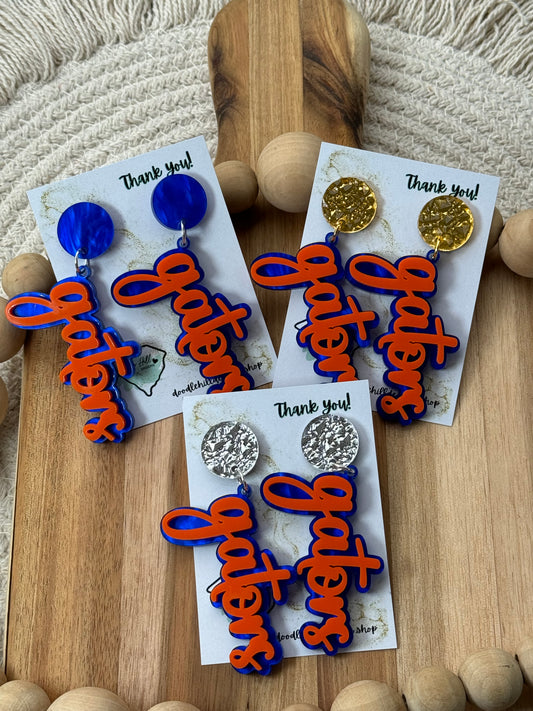 Game day spirit earrings, GATORS, earrings are two layers of acrylic blue and orange with different  gold post 