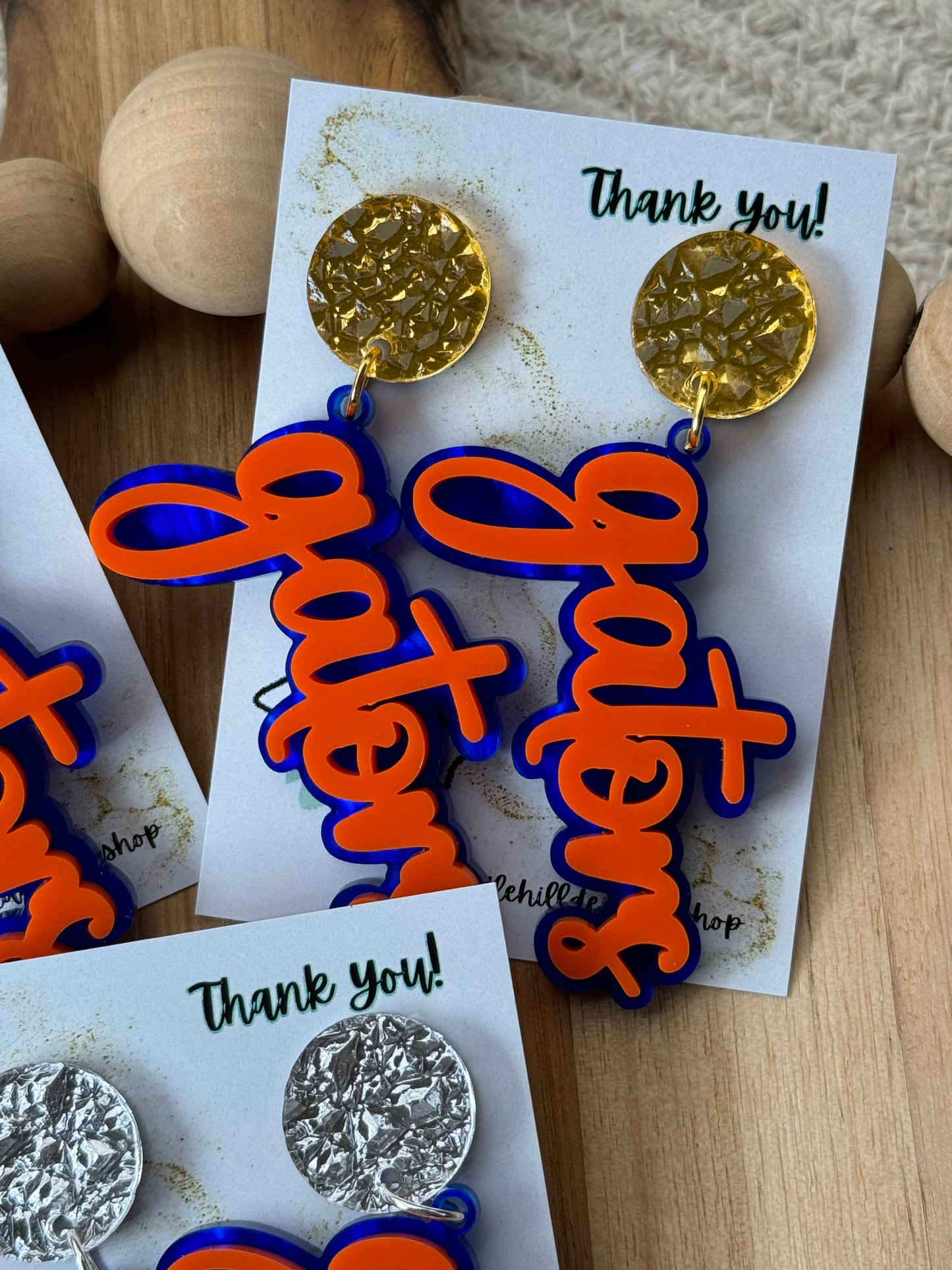 Game day spirit earrings, GATORS, earrings are two layers of acrylic blue and orange with different  gold post 