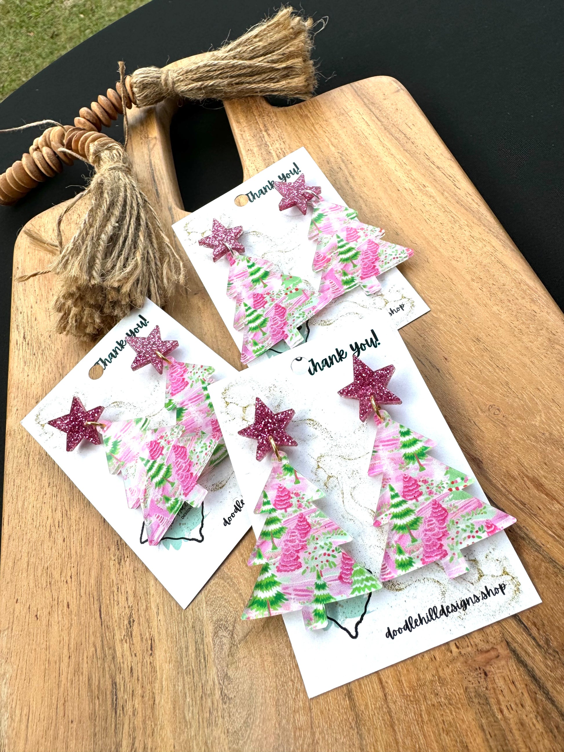 clear pastel pink and green christmas tree print with christmas tree shaped.Post are pink glitter stars 