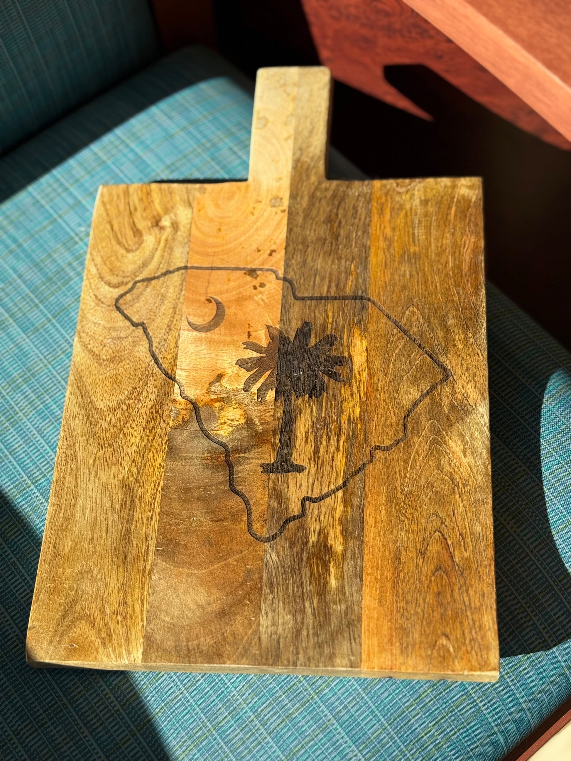 Personalized decorative cutting board with the state of south carolina with palmetto tree inside state