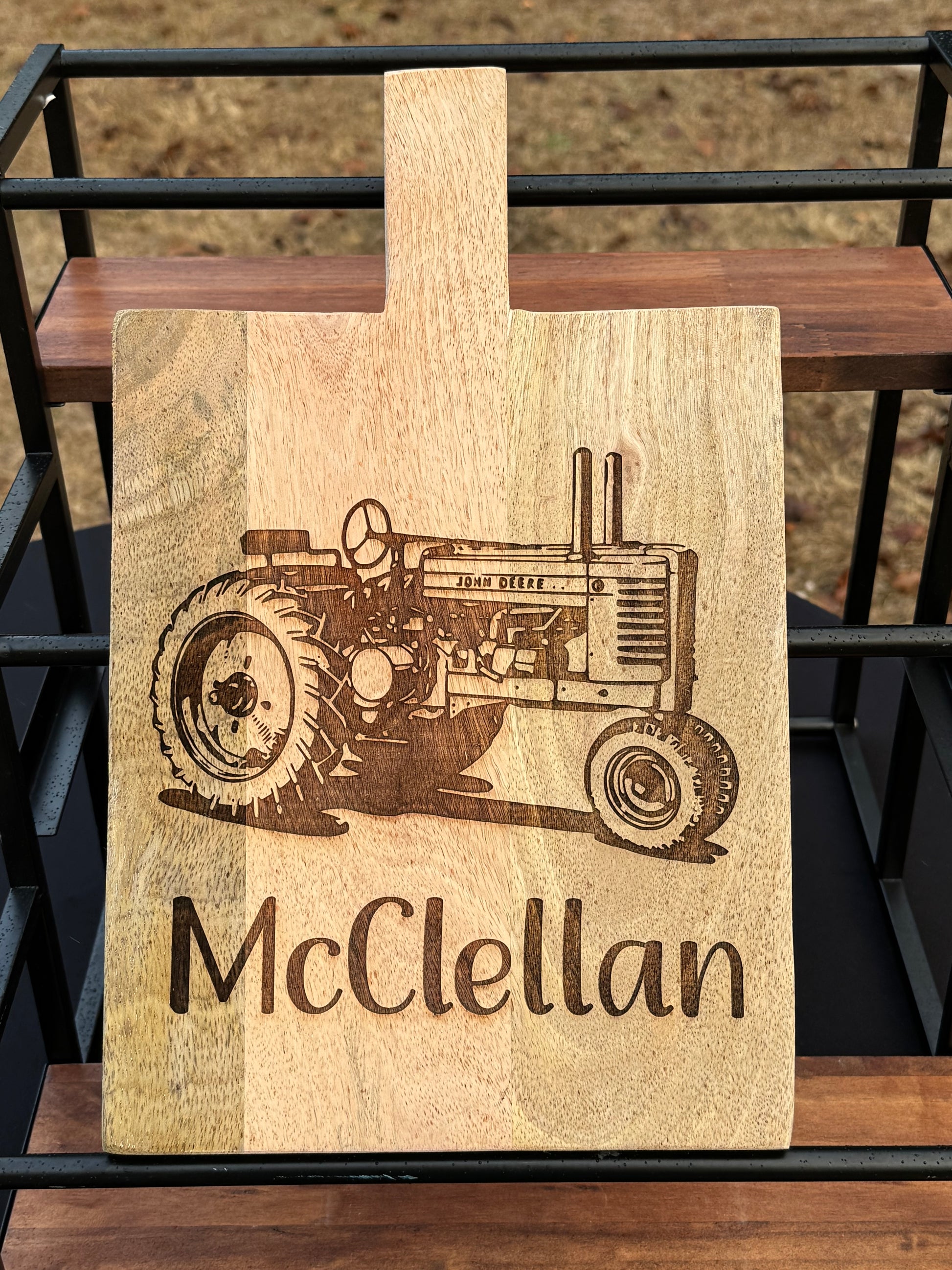 Persoanlized decorative cutting board with john deer tractor and family name under