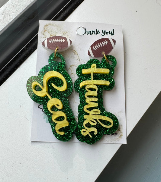 game day two tone acrylic earrings green glitter and gold acrylic Sea Hawk earrings with football post 