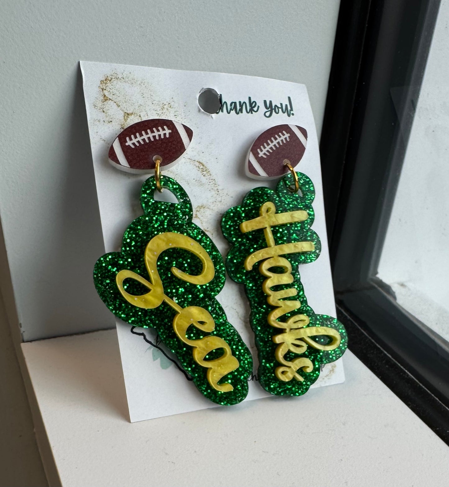 game day two tone acrylic earrings green glitter and gold acrylic Sea Hawk earrings with football post 