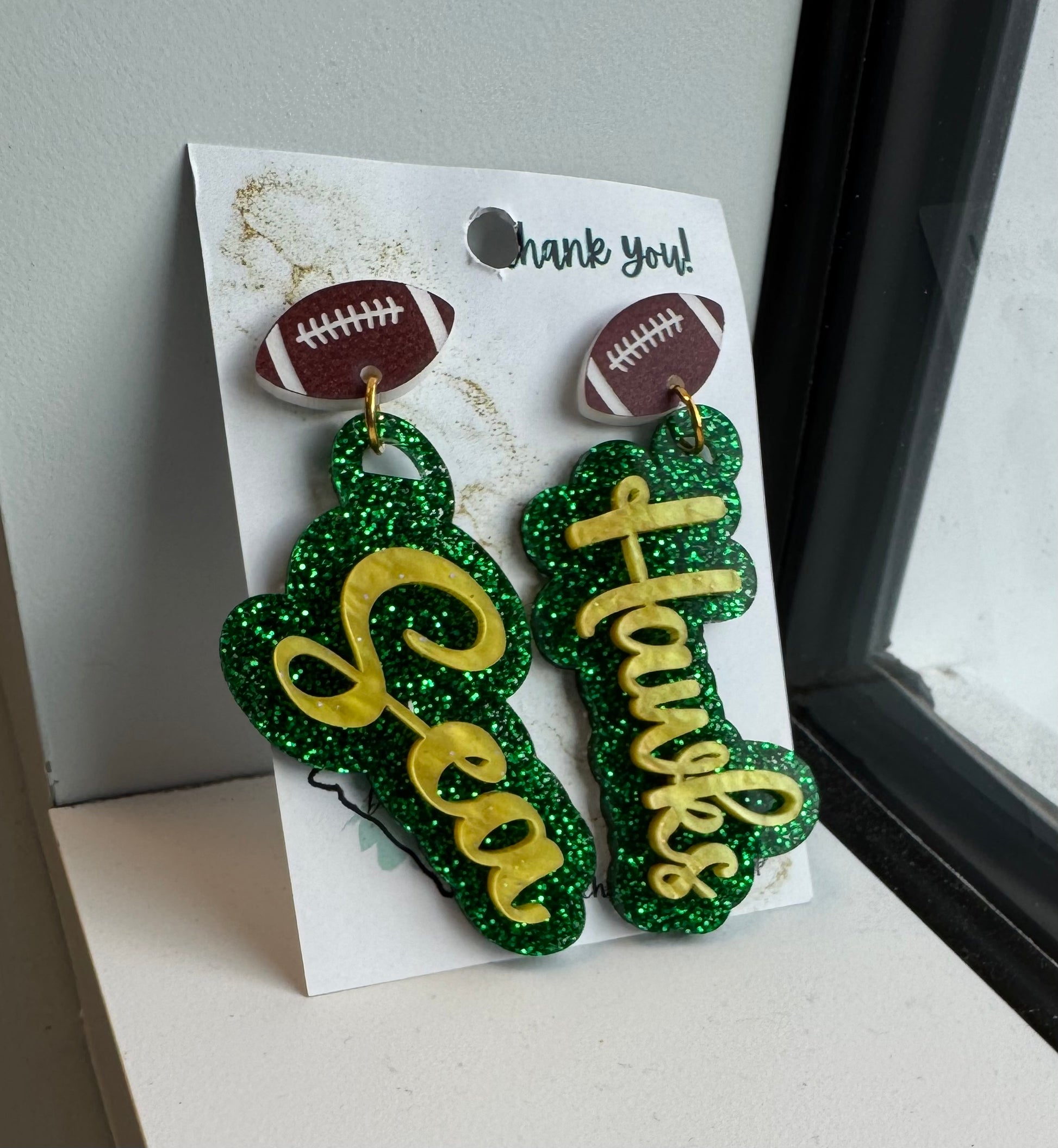 game day two tone acrylic earrings green glitter and gold acrylic Sea Hawk earrings with football post 