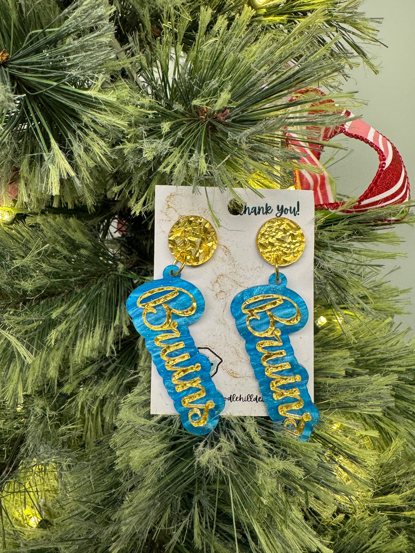 Game day Bruins earrings with gold textured post and blue and gold lettering 