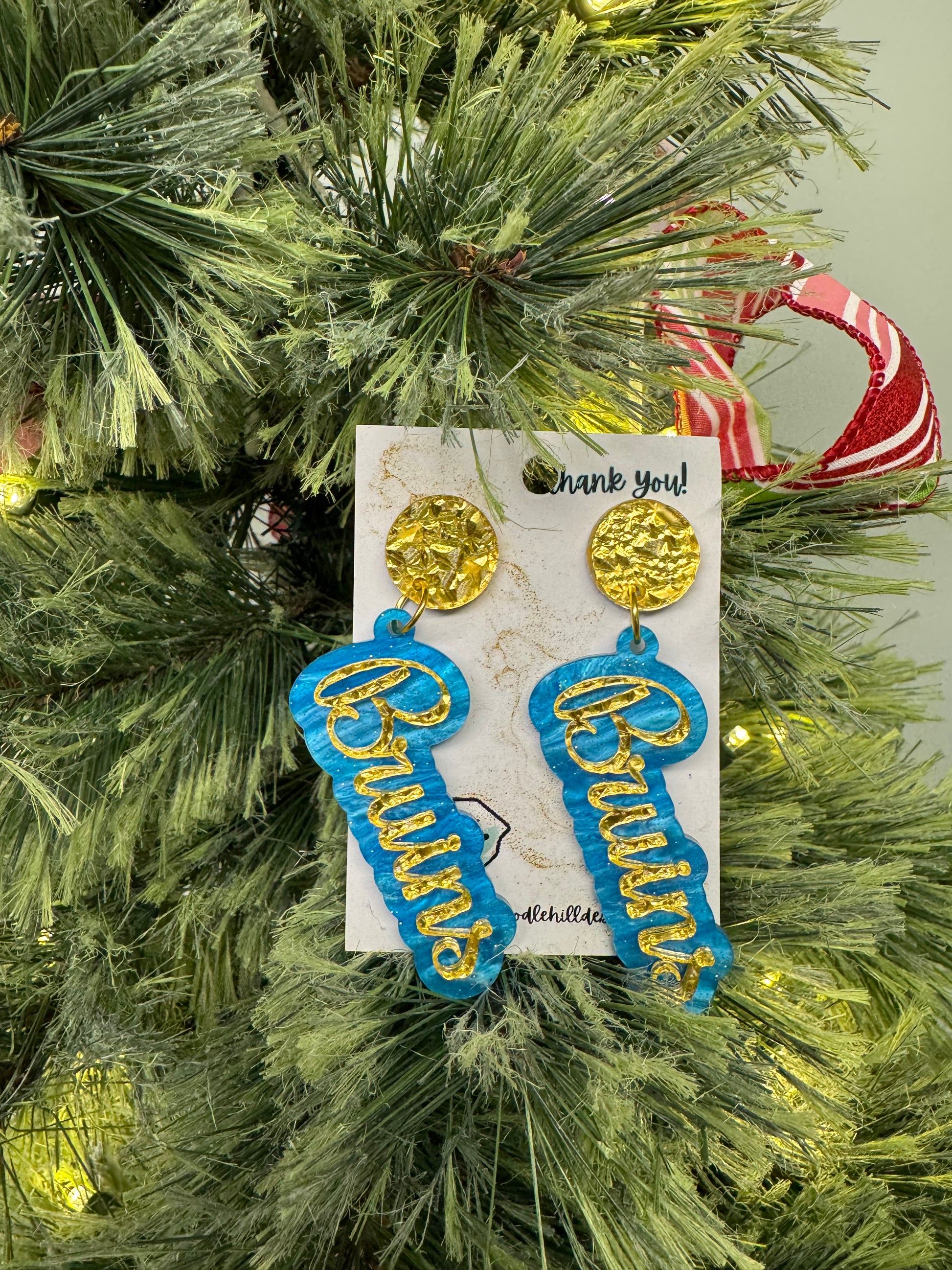 Game day Bruins earrings with gold textured post and blue and gold lettering 
