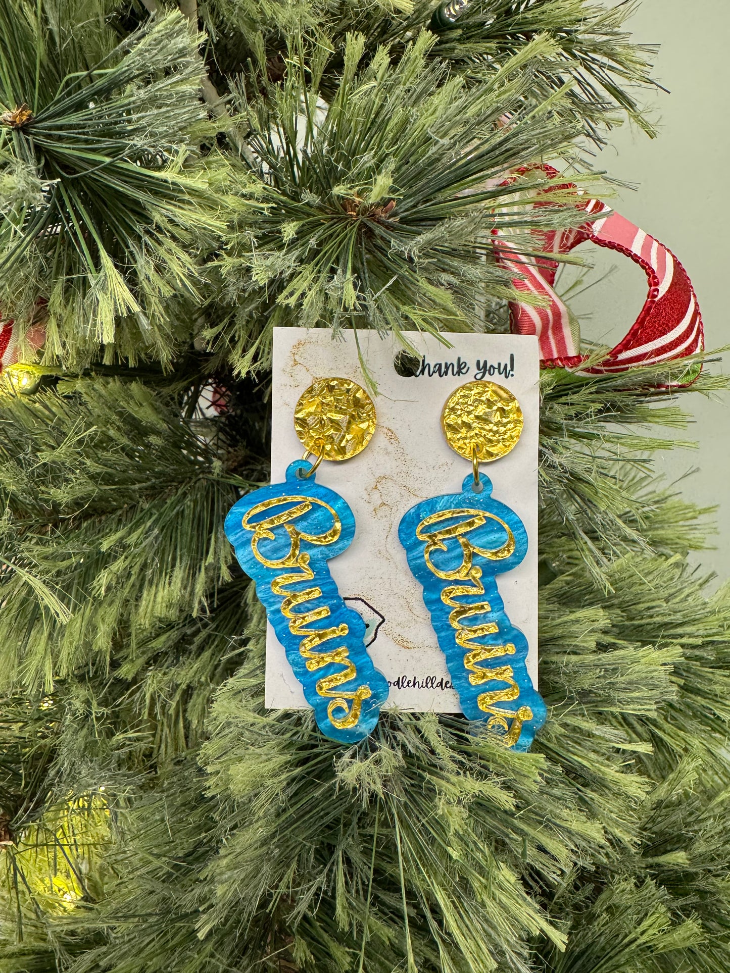 Game day Bruins earrings with gold textured post and blue and gold lettering 