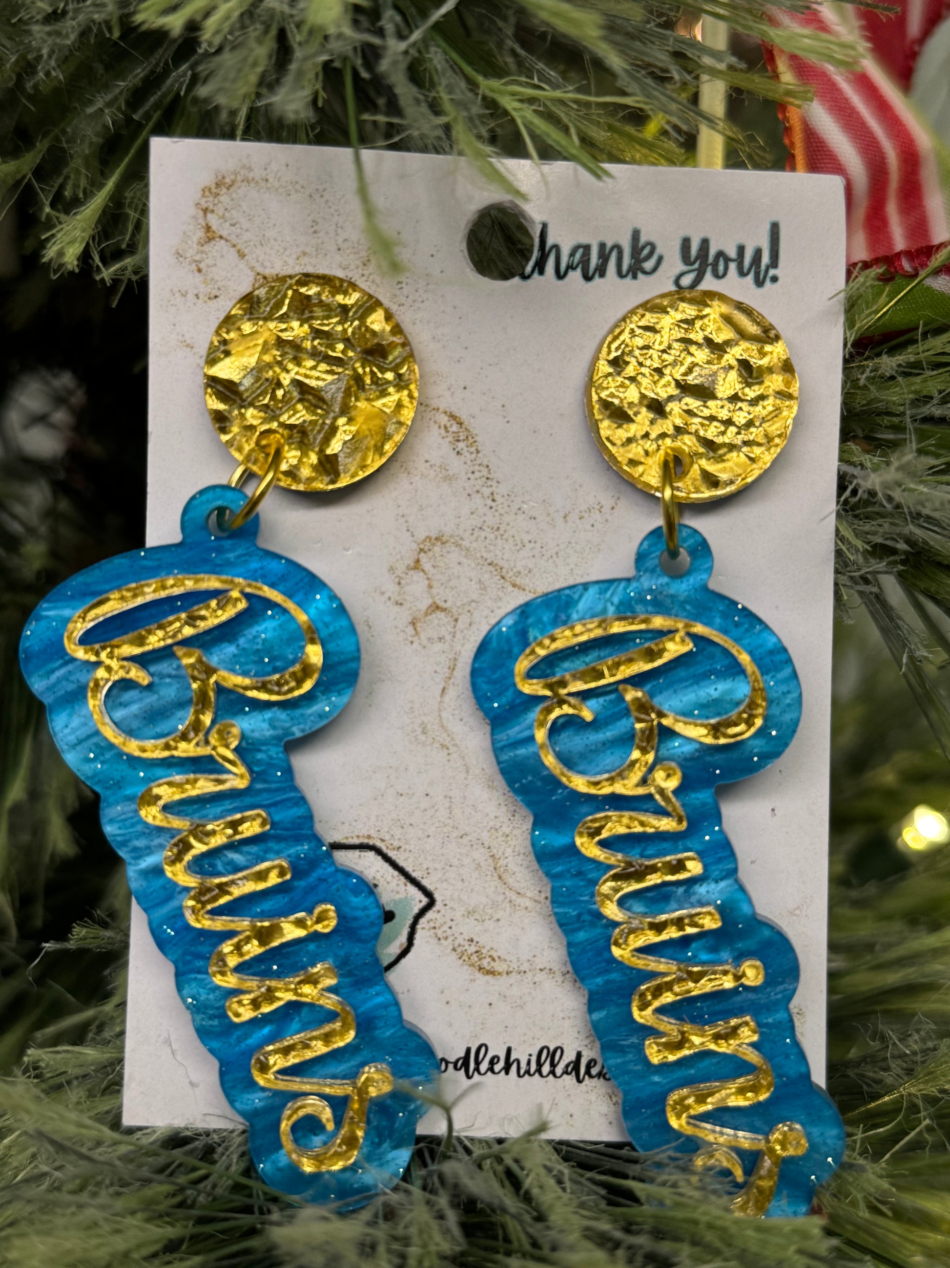Game day Bruins earrings with gold textured post and blue and gold lettering 