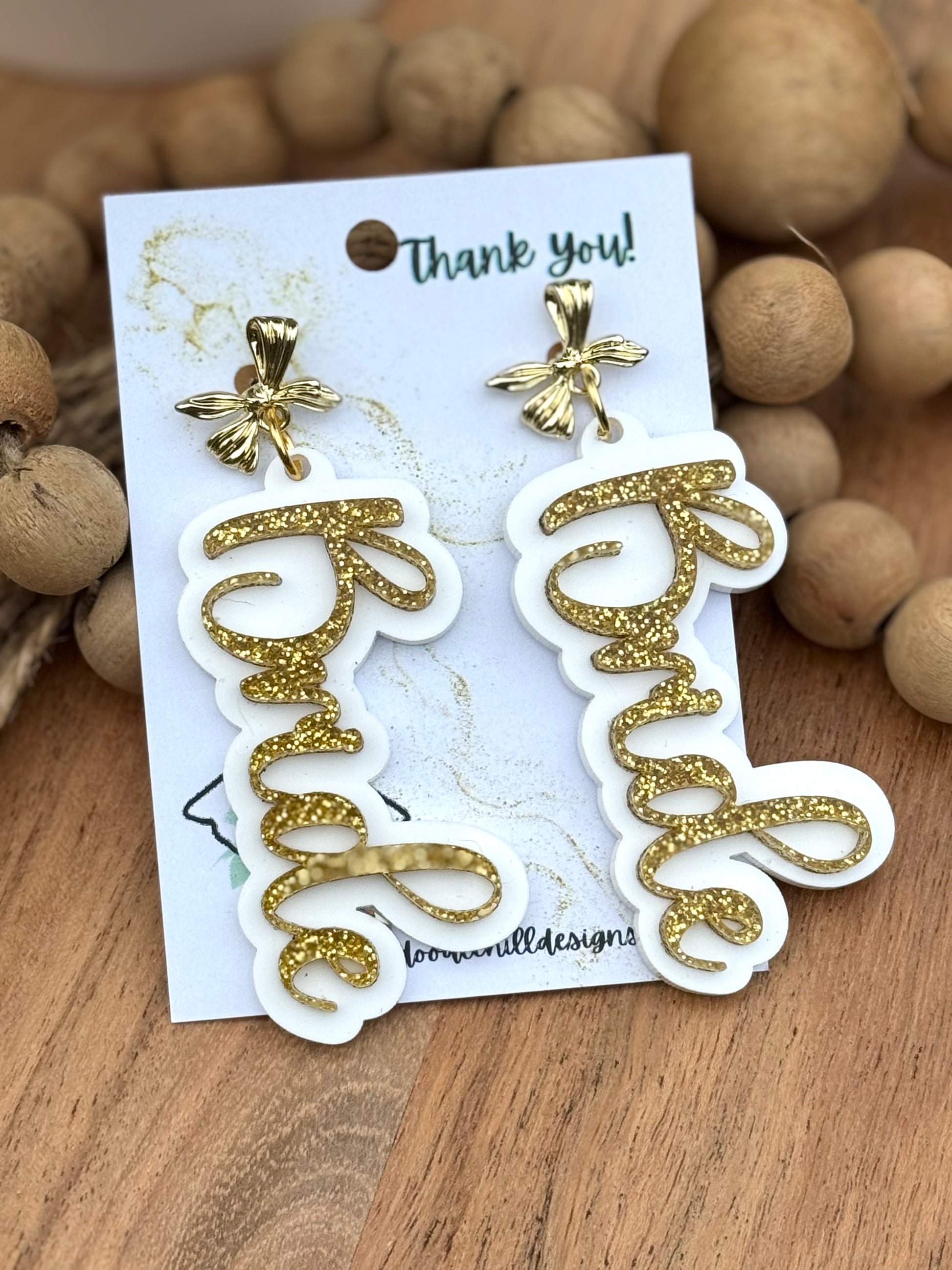 "Bride earrings for bachelorette party – lightweight white acrylic with gold glitter script. Bridal shower jewelry with gold bow posts, perfect wedding gift for bride-to-be. Trendy statement earrings for casual or formal bridal bride earrings, bachelorette party, bridal shower jewelry, wedding gift, statement earrings, and gold glitter script, ents.
