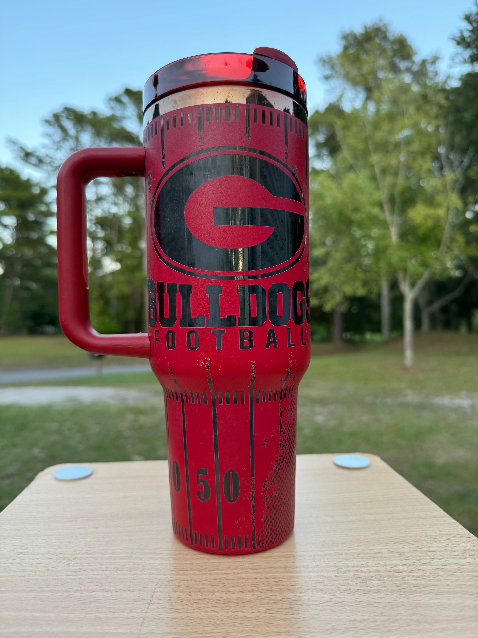 Georgia game day essentials 40 oz unbranded tumbler red with black engraving with a Georgia football theme tailgate