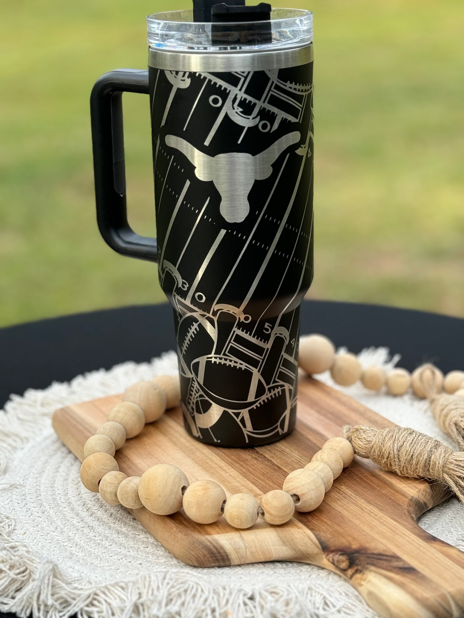 Texas longhorn game day essentials 40 oz unbranded tumbler black or white lasered engraved with a Texan longhorn
