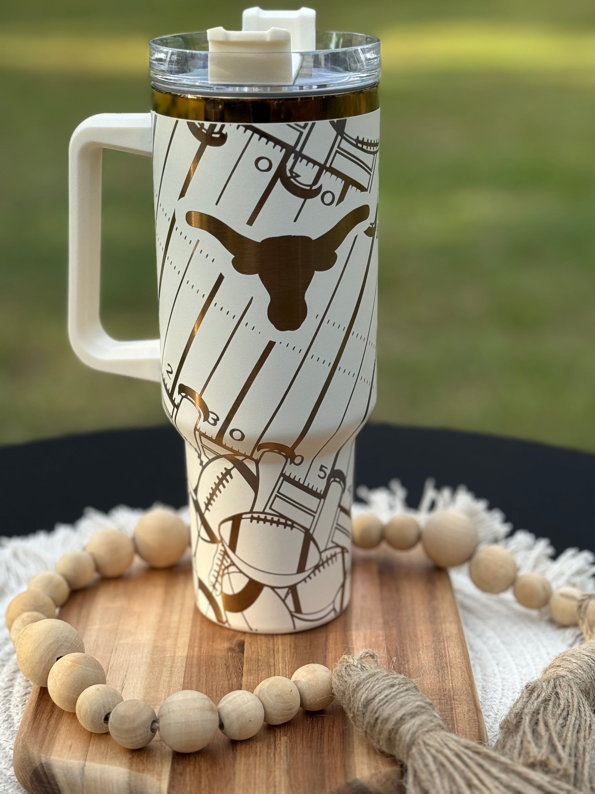 Texas longhorn game day essentials 40 oz unbranded tumbler black or white lasered engraved with a Texan longhorn
